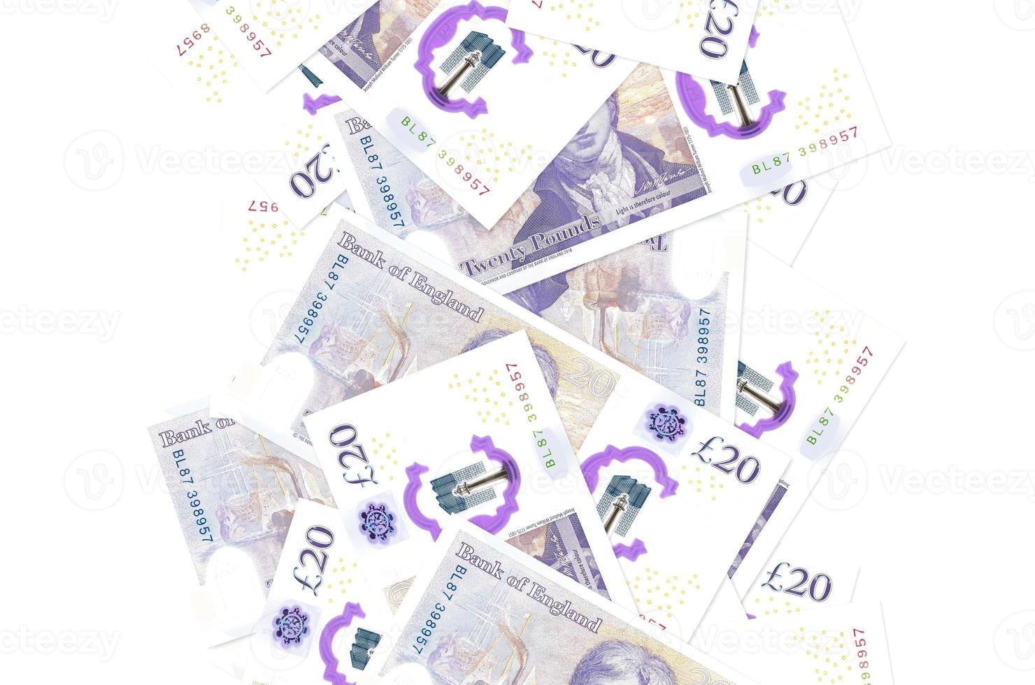 20 British pounds bills flying down isolated on white. Many banknotes falling with white copyspace on left and right side photo