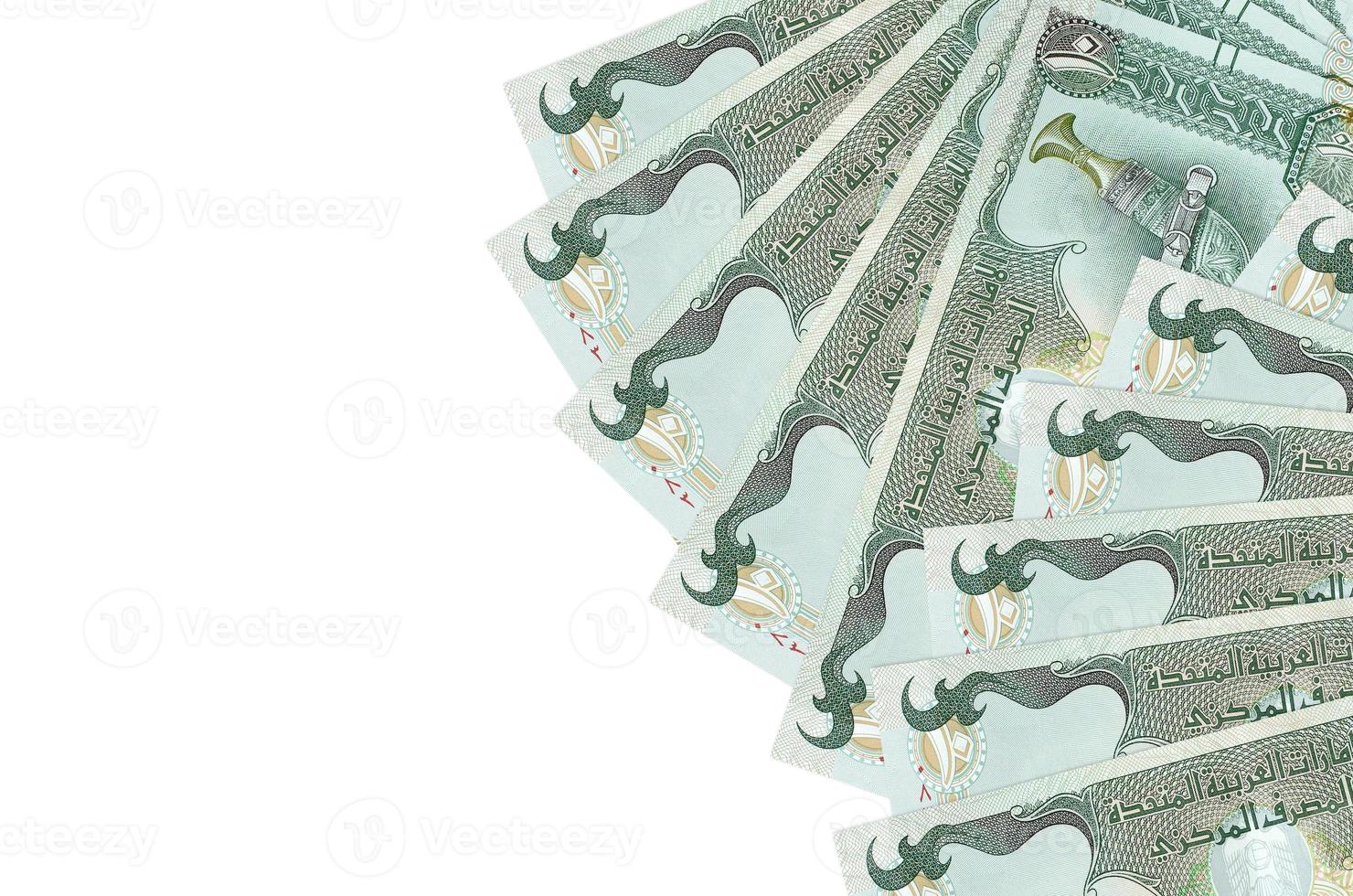 10 UAE dirhams bills lies isolated on white background with copy space. Rich life conceptual background photo