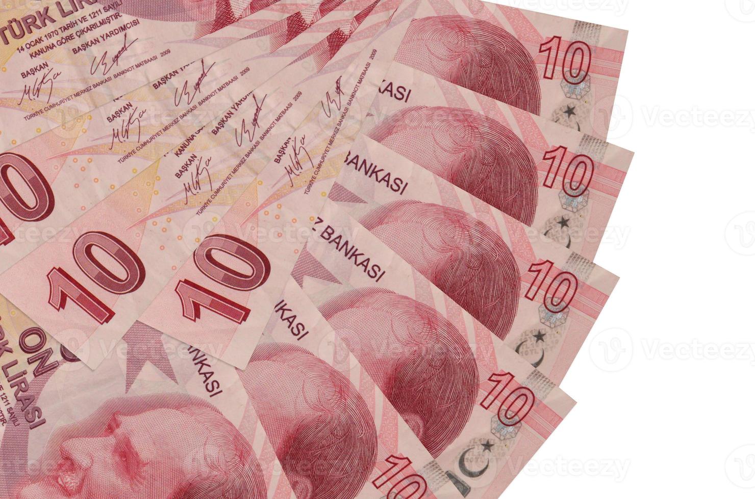 10 billetes de liras turcas se encuentran aislados en fondo blanco con espacio de copia apilado en forma de abanico de cerca foto