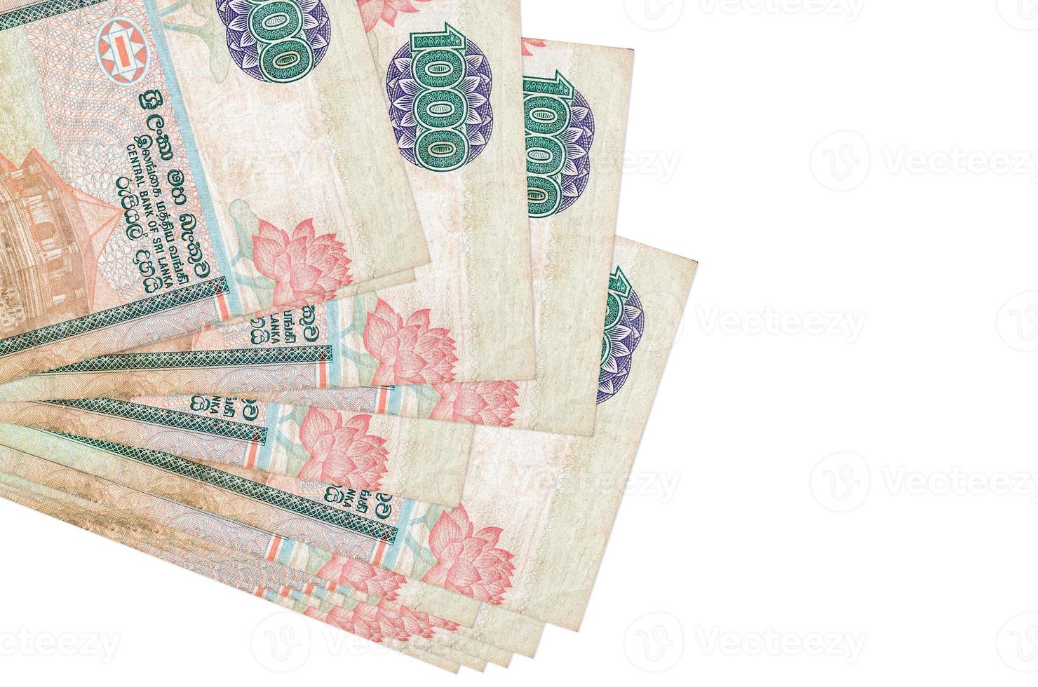 1000 Sri Lankan rupees bills lies in small bunch or pack isolated on white. Mockup with copy space. Business and currency exchange photo