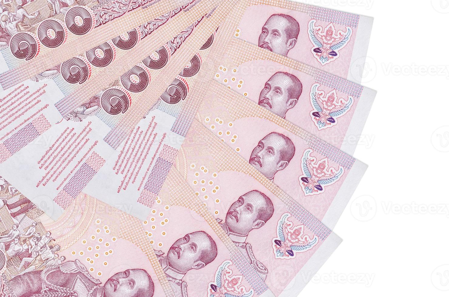 100 Thai Baht bills lies isolated on white background with copy space stacked in fan shape close up photo