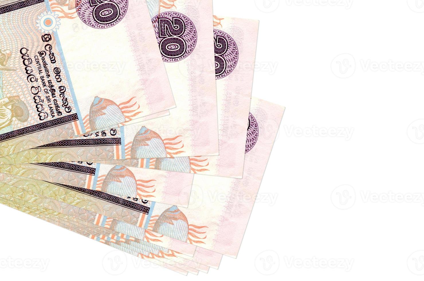 20 Sri Lankan rupees bills lies in small bunch or pack isolated on white. Mockup with copy space. Business and currency exchange photo