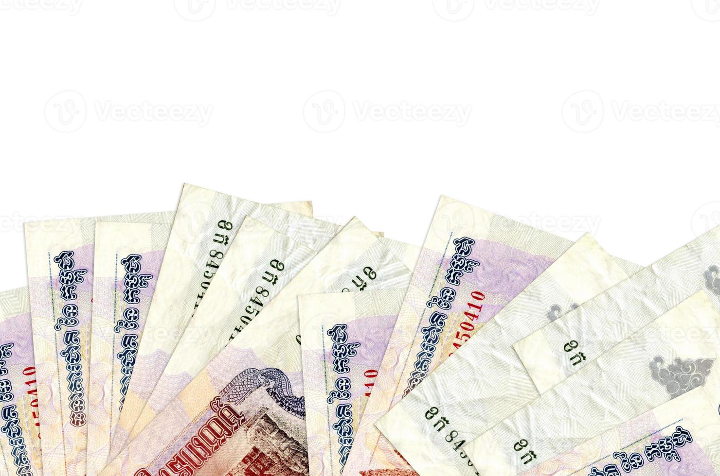 1000 Cambodian riels bills lies on bottom side of screen isolated on white background with copy space. Background banner template photo