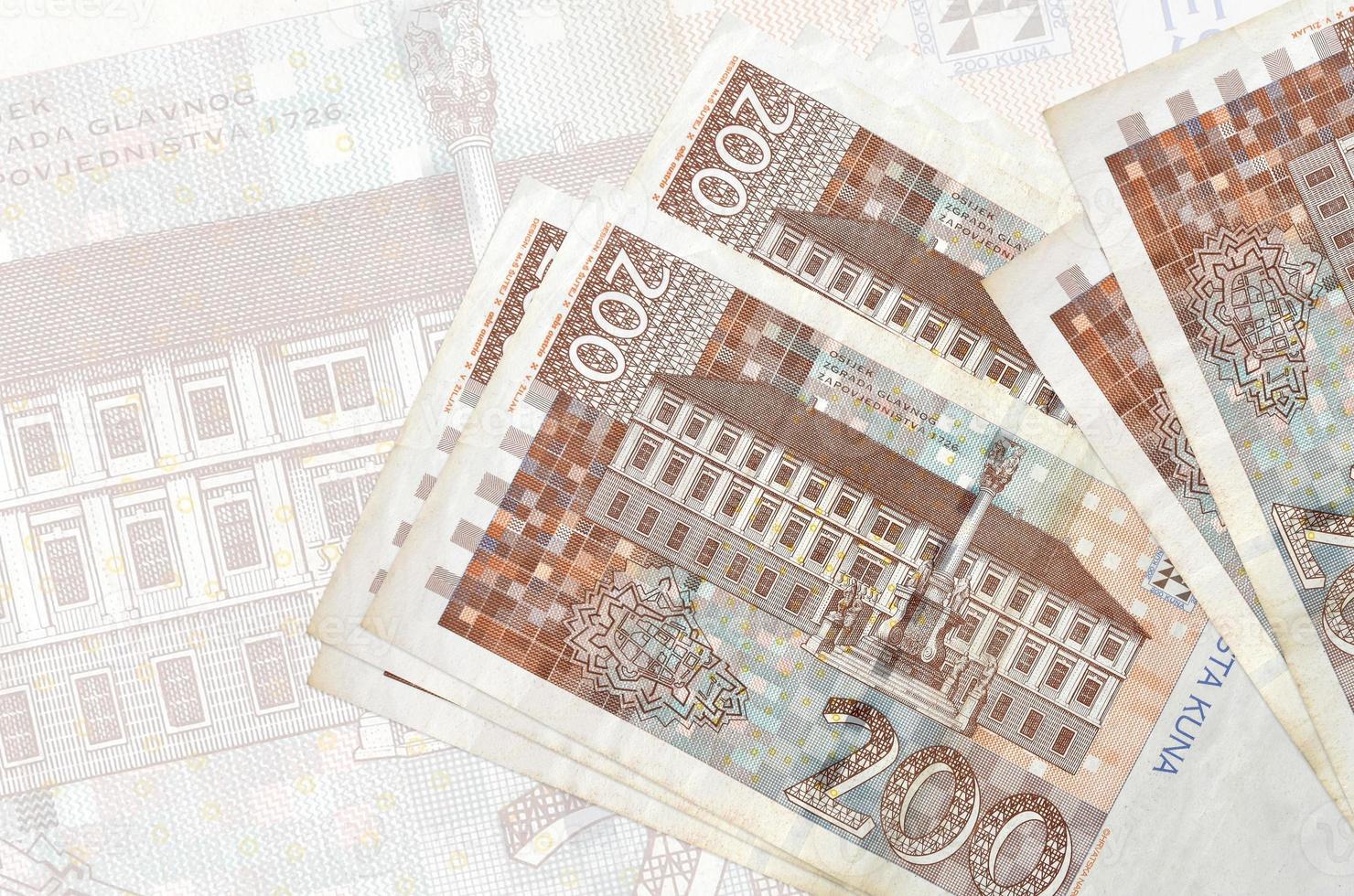 200 Croatian Kuna Bills Lies In Stack On Background Of Big Semi 200-croatian-kuna-bills-lies-in-stack-on-background-of-big-semi