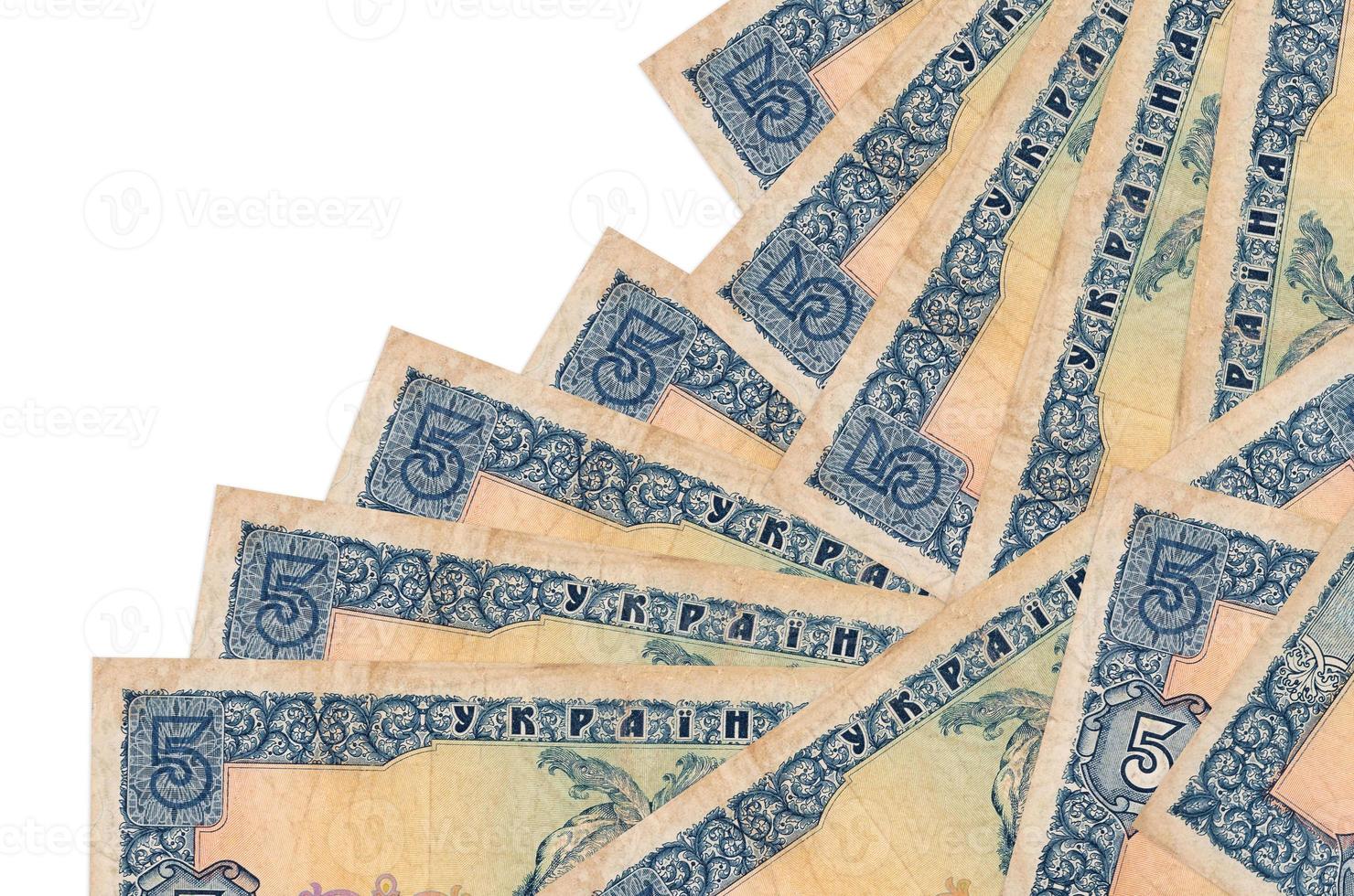 5 Ukrainian hryvnias bills lies in different order isolated on white. Local banking or money making concept photo