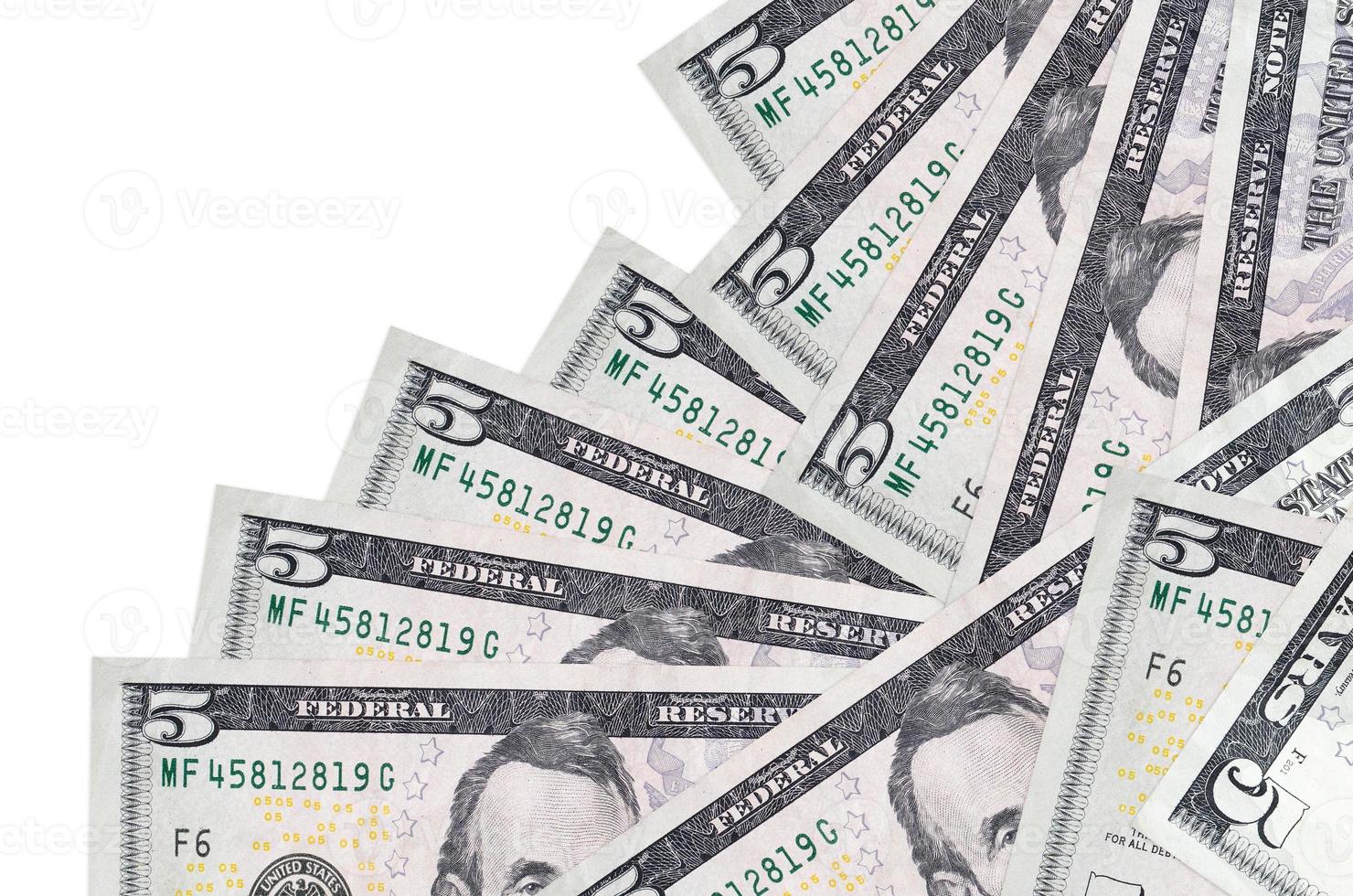 5 US dollars bills lies in different order isolated on white. Local banking or money making concept photo