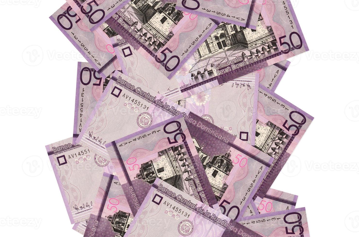 50 Dominican pesos bills flying down isolated on white. Many banknotes falling with white copyspace on left and right side photo