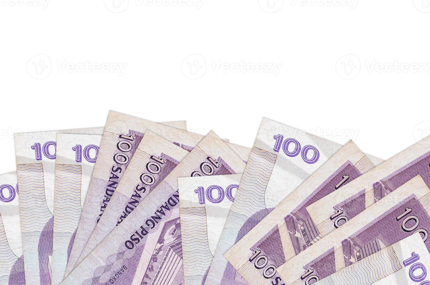 100 Philippine piso bills lies on bottom side of screen isolated on white background with copy space. Background banner template photo