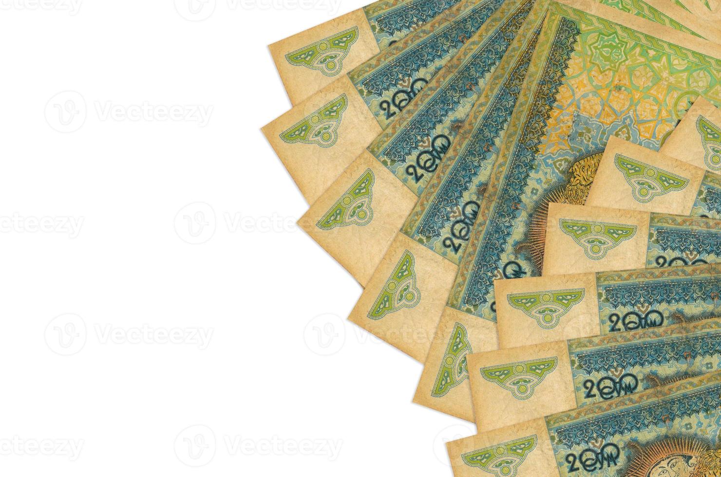 200 Uzbekistani som bills lies isolated on white background with copy space. Rich life conceptual background photo