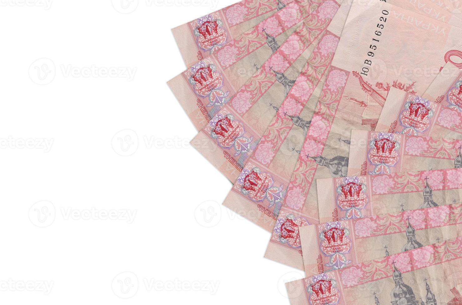 10 Ukrainian hryvnias bills lies isolated on white background with copy space. Rich life conceptual background photo