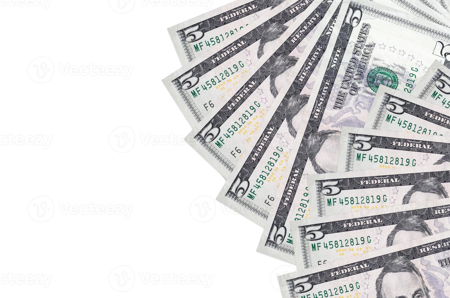 5 US dollars bills lies isolated on white background with copy space. Rich life conceptual background photo