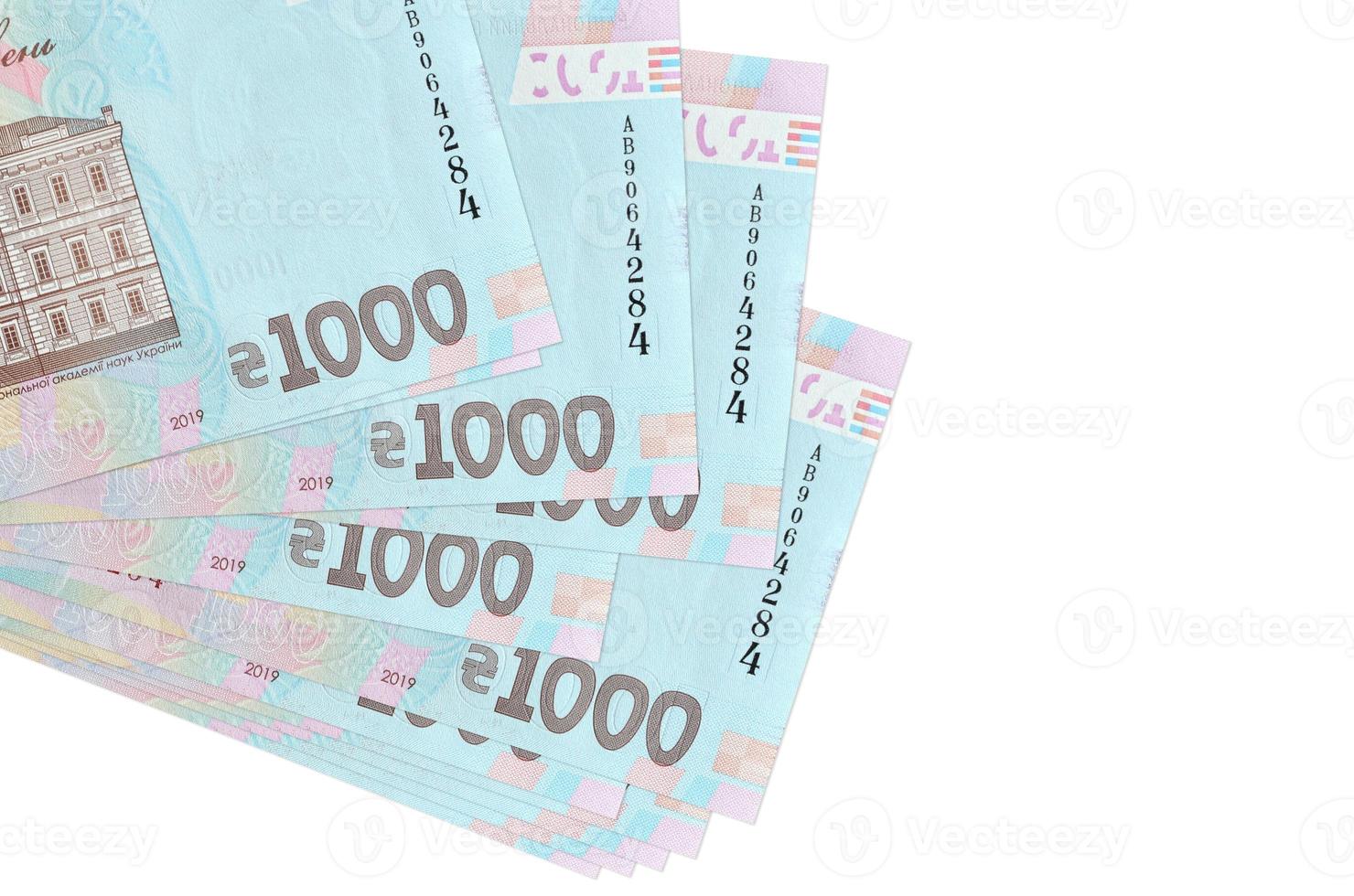 1000 Ukrainian hryvnias bills lies in small bunch or pack isolated on white. Mockup with copy space. Business and currency exchange photo