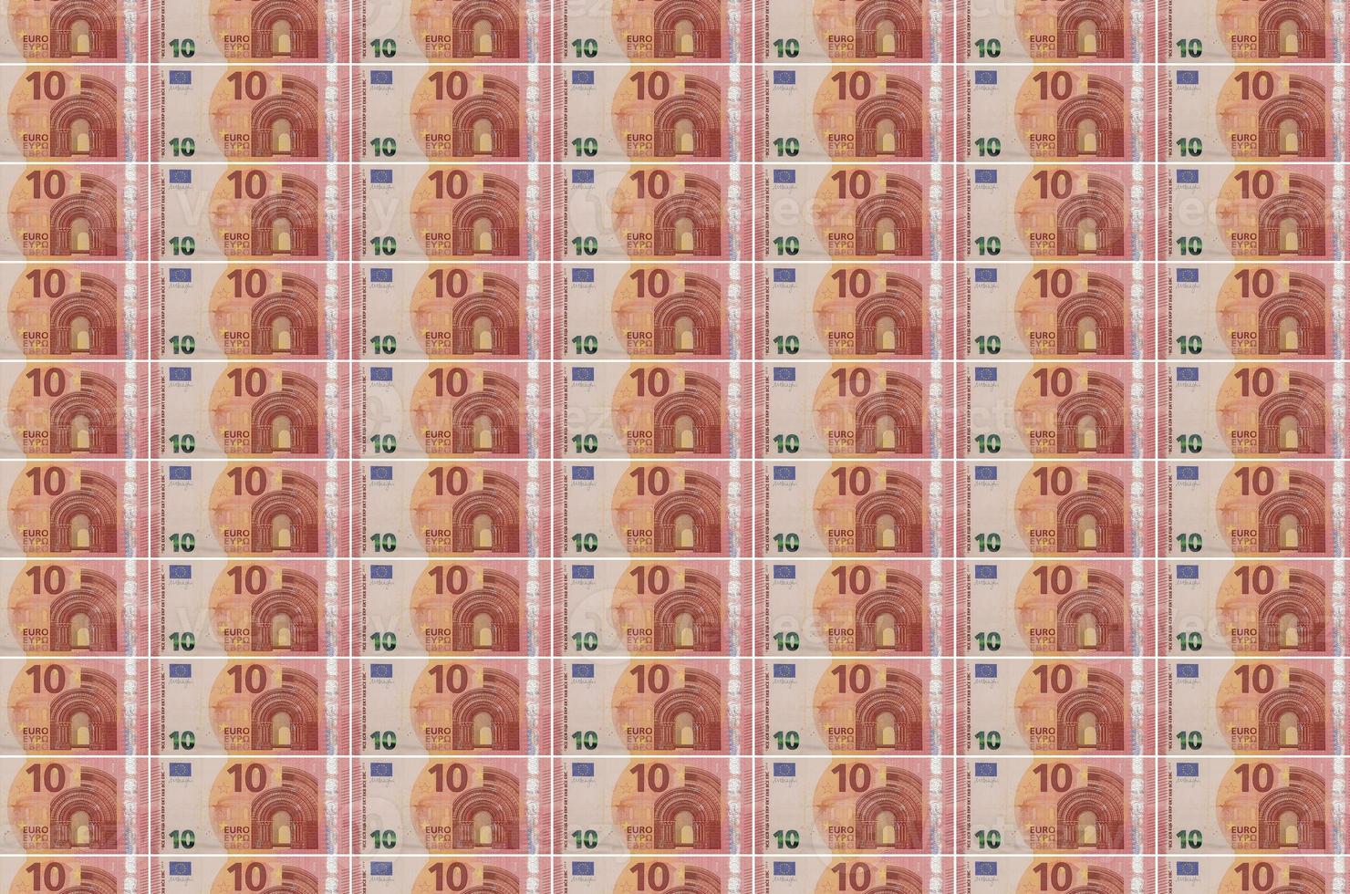 10 euro bills printed in money production conveyor. Collage of many bills. Concept of currency devaluation photo