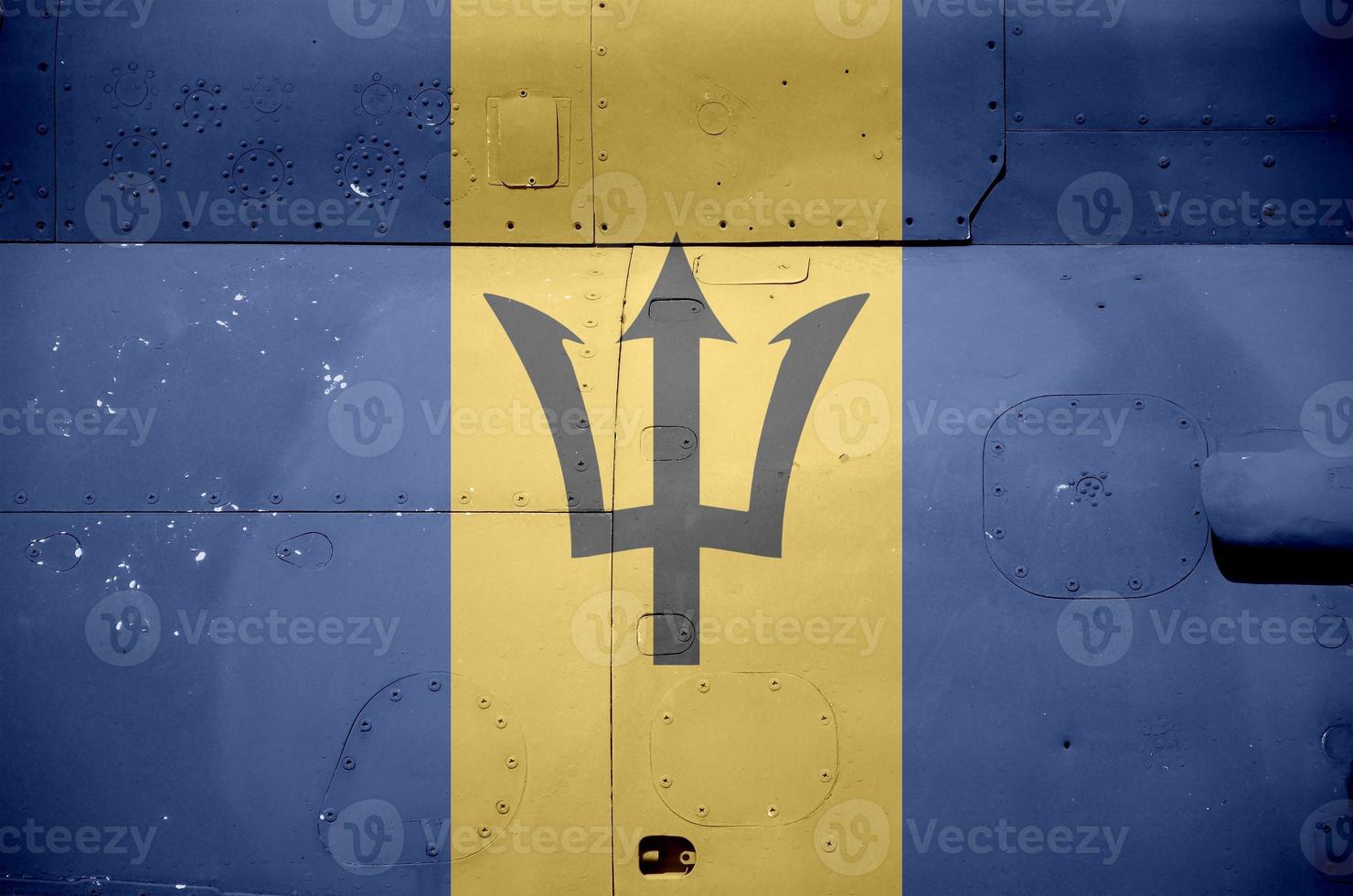 Barbados flag depicted on side part of military armored helicopter closeup. Army forces aircraft conceptual background photo