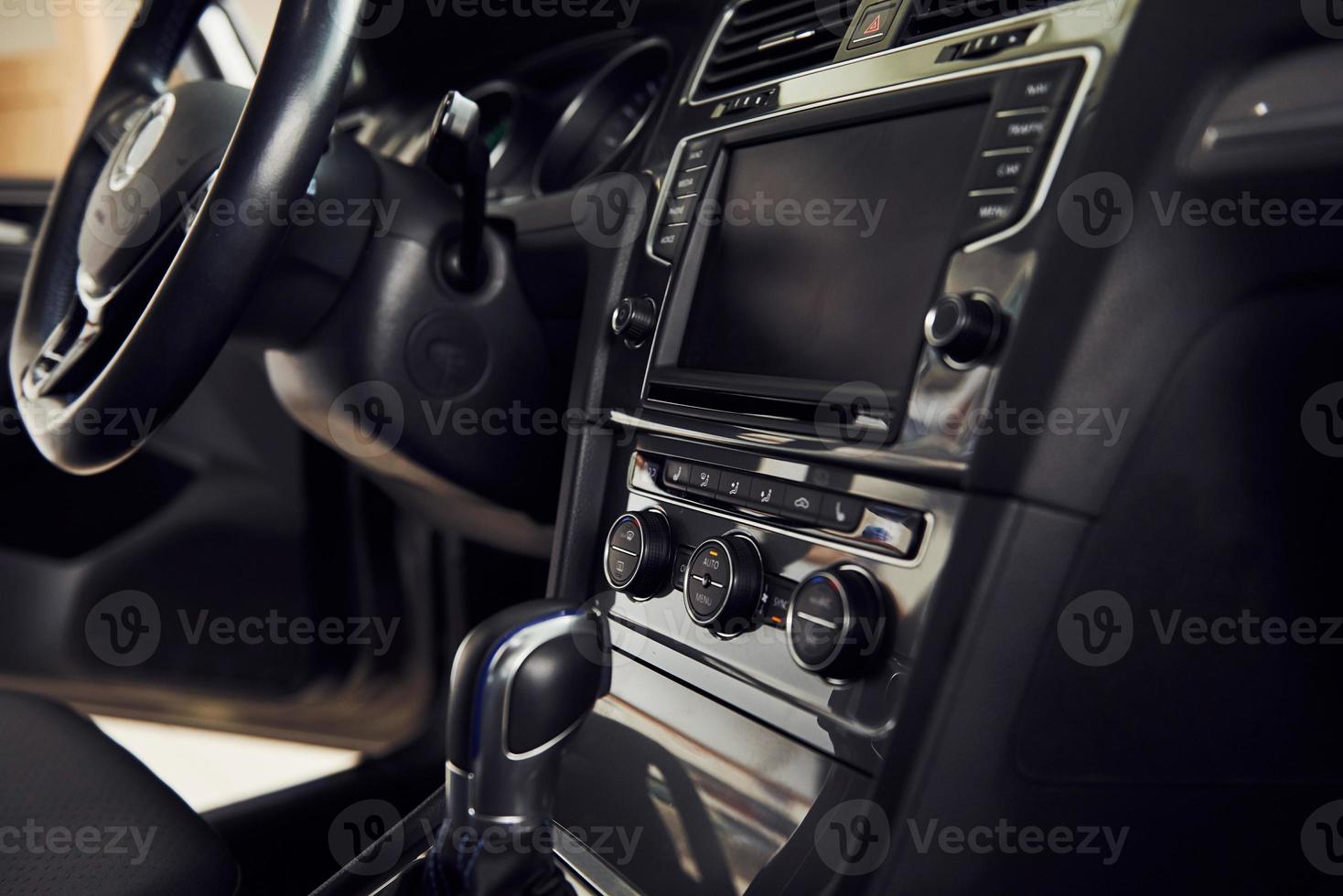 Inside of brand new modern electrical car. Particle view. Cropped photo