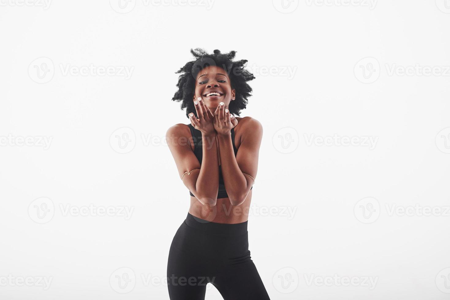 Perfect body shape. Young beautiful afro american woman in the studio against white background photo