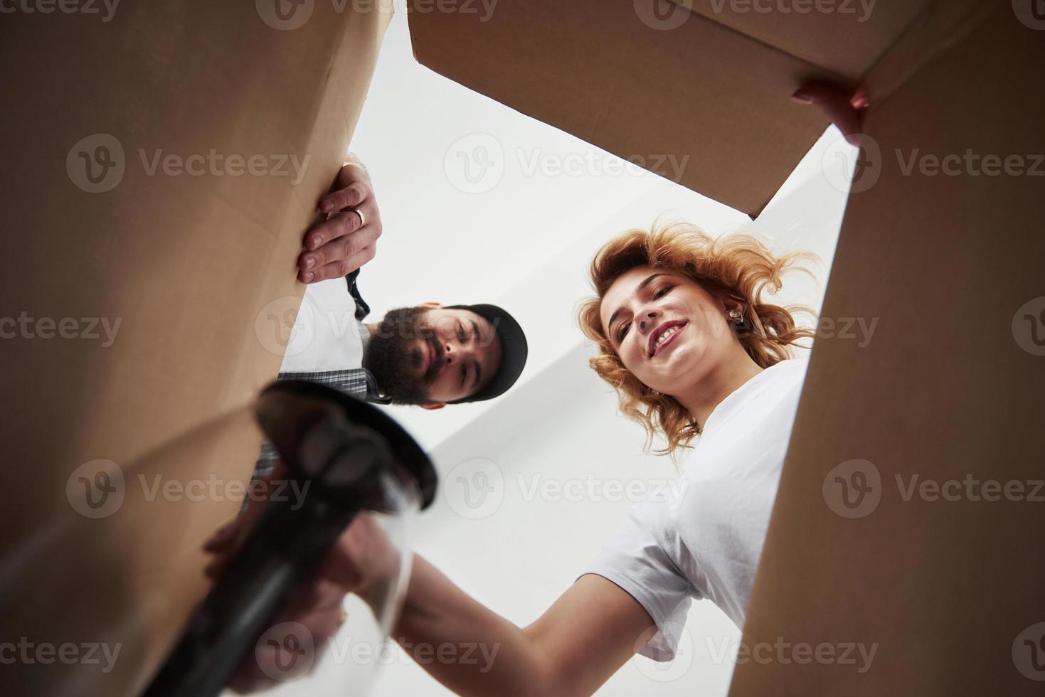 This is for the kitchen. Happy couple together in their new house. Conception of moving photo