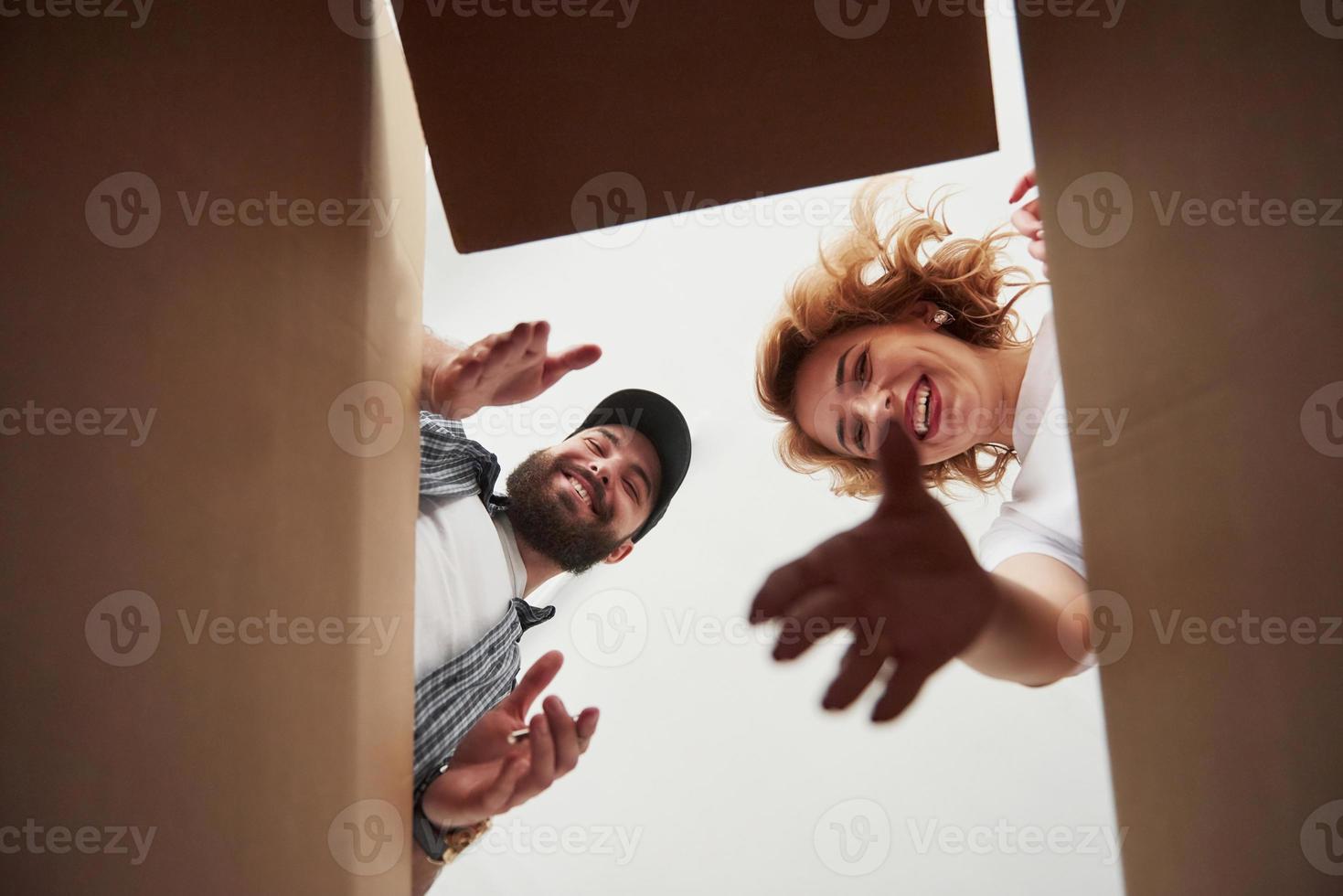 Playful mood. Happy couple together in their new house. Conception of moving photo