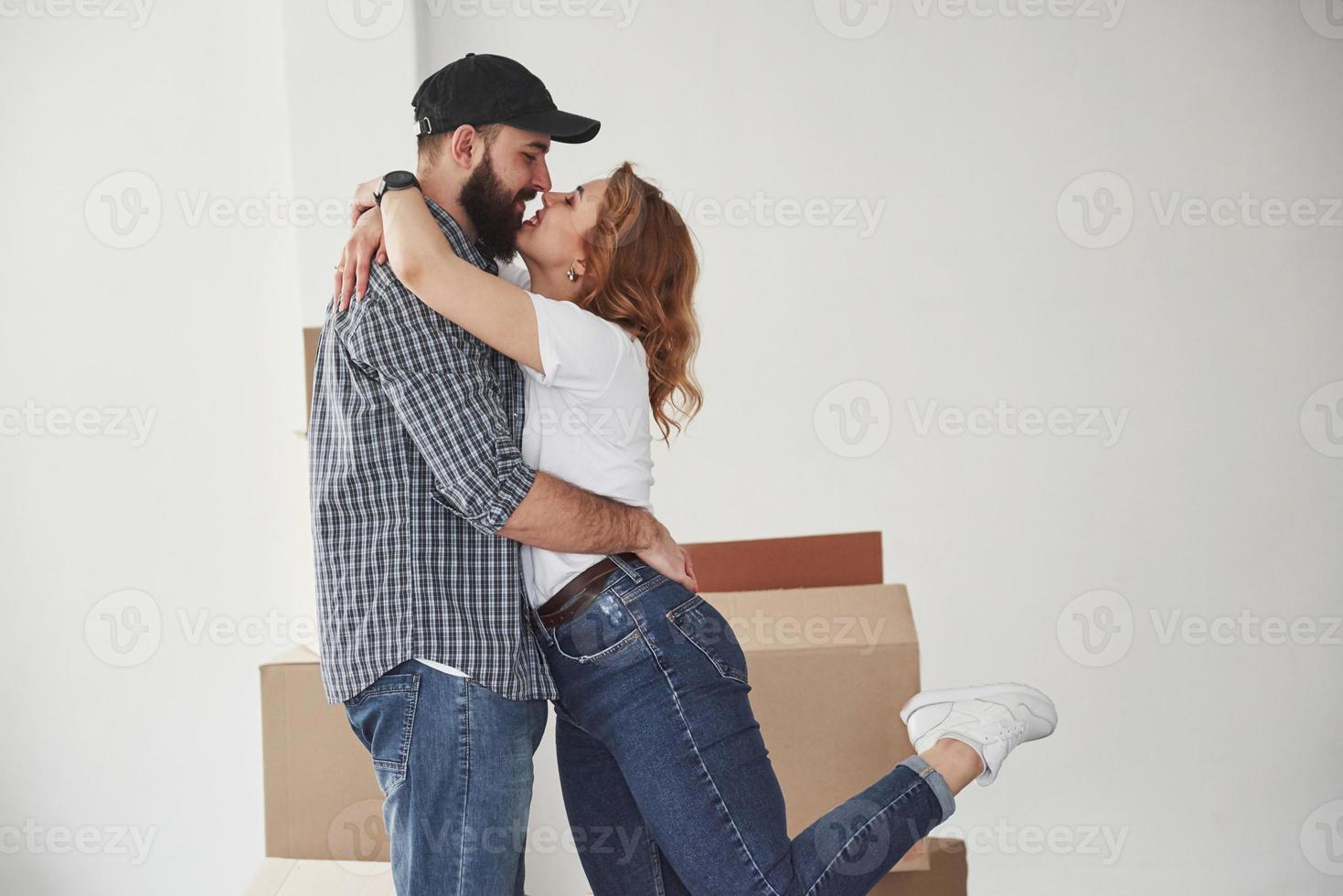 Pure love. Happy couple together in their new house. Conception of moving photo
