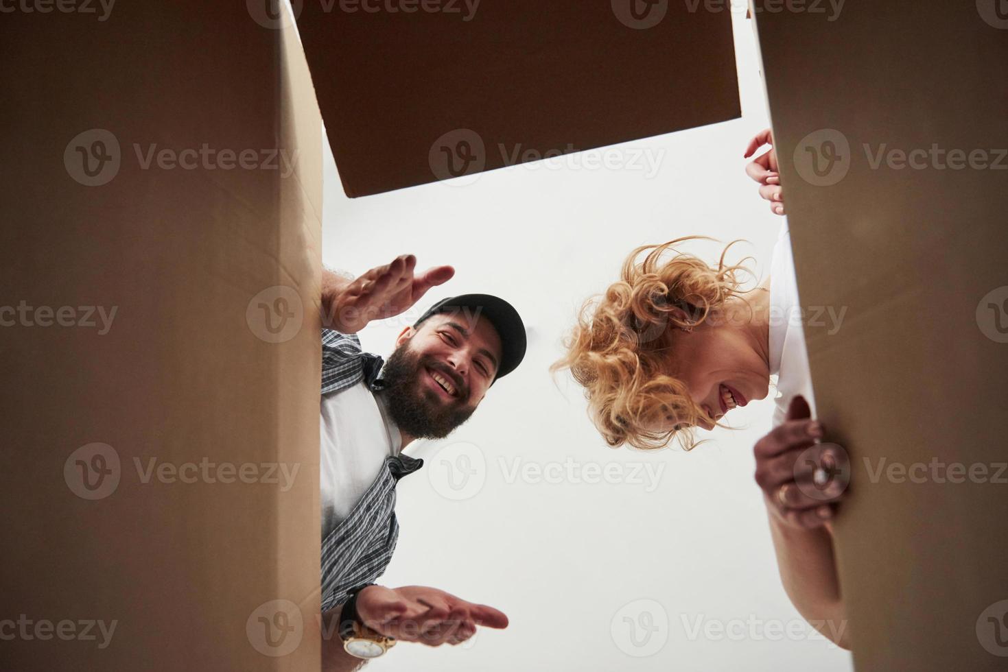 What a surprise. Happy couple together in their new house. Conception of moving photo