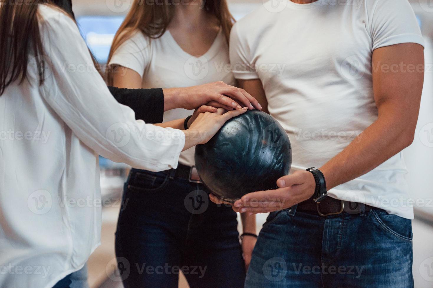 Let's start the game. Cropped view of people at the bowling club ready to have some fun photo