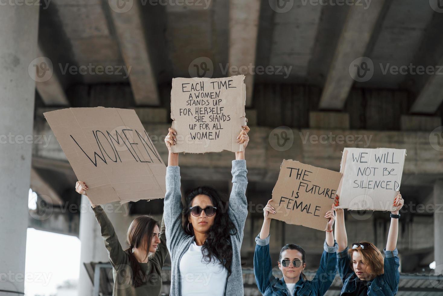 Cloudly weather. Group of feminist women have protest for their rights outdoors photo