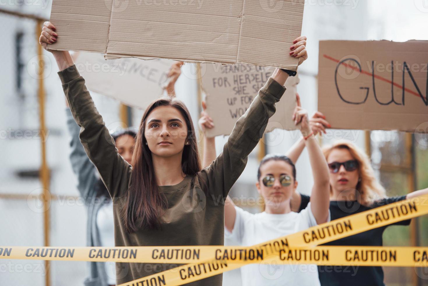 Good day to make a demonstration. Group of feminist women have protest for their rights outdoors photo