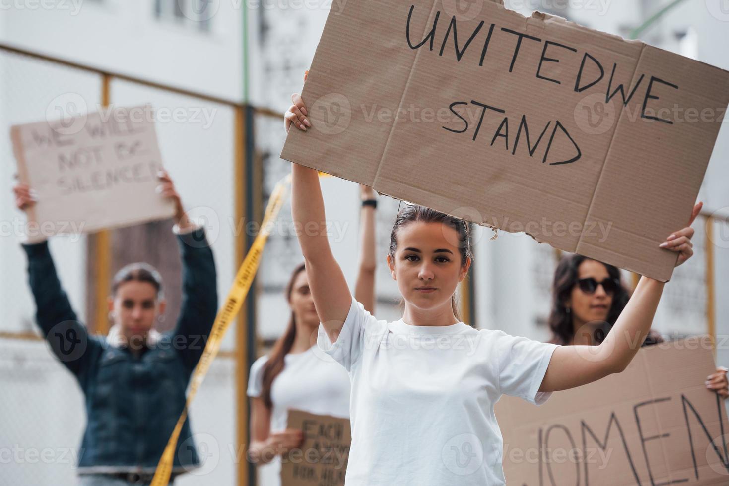 Day of rebellion. Group of feminist women have protest for their rights outdoors photo