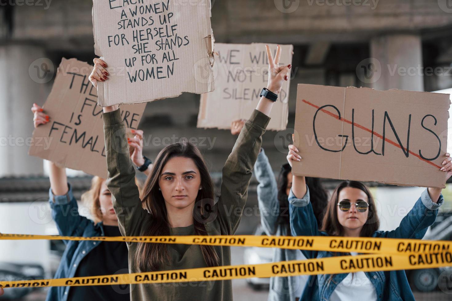 Speak about everything you displeased. Group of feminist women have protest for their rights outdoors photo