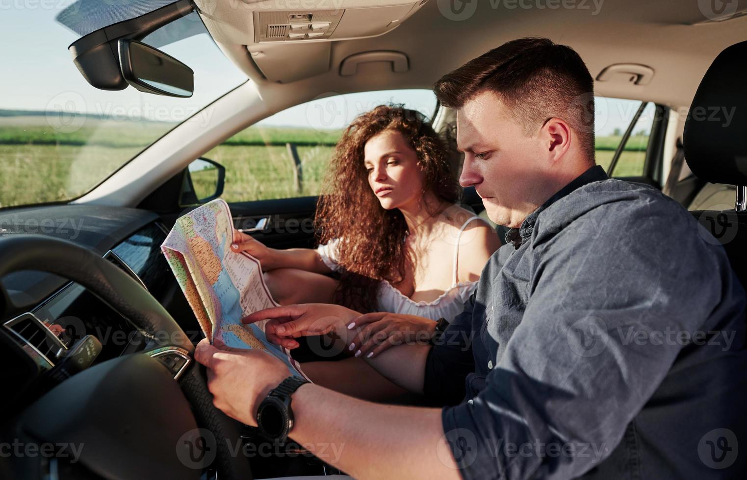 Worried and in trouble. Beautiful people is in the modern car at their weekends photo