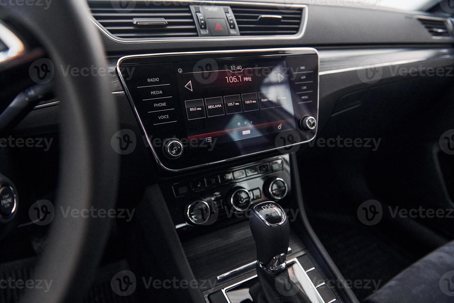 Front panel of brand new modern vehicle with digital tablet and control panel photo