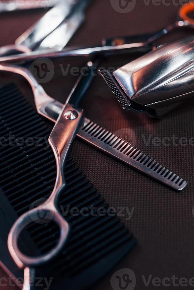 Close up view of vintage barber shop tools that lying down on the table photo