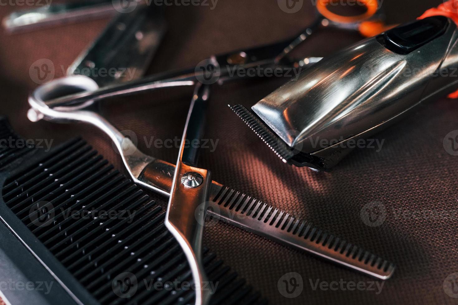 Close up view of vintage barber shop tools that lying down on the table photo