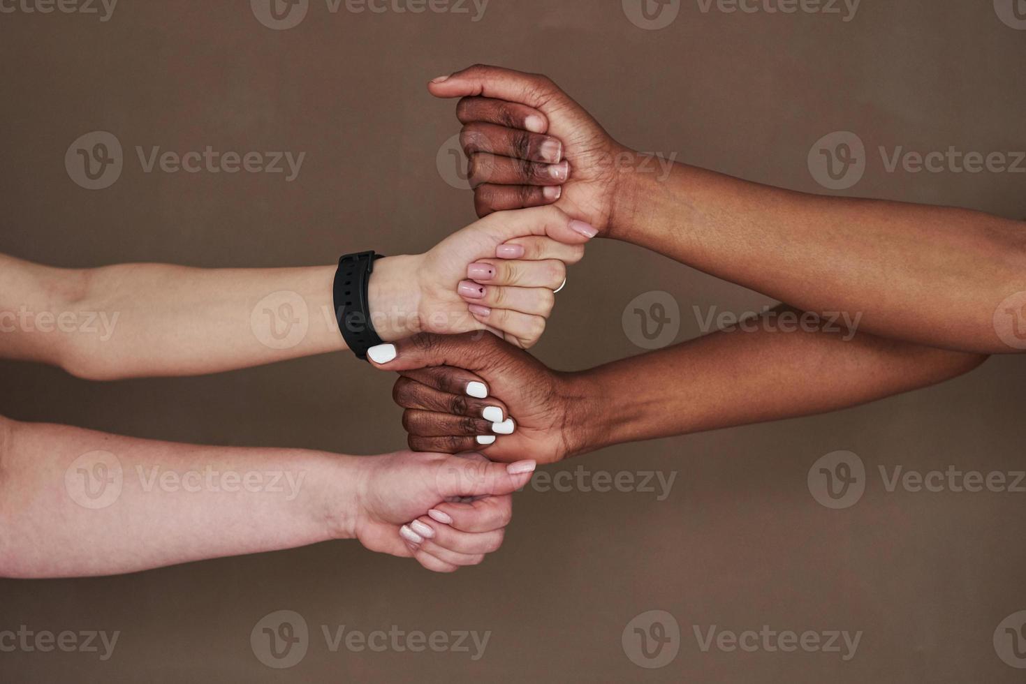 We can do it. Side view of women's hands in gesture. Conception of success photo