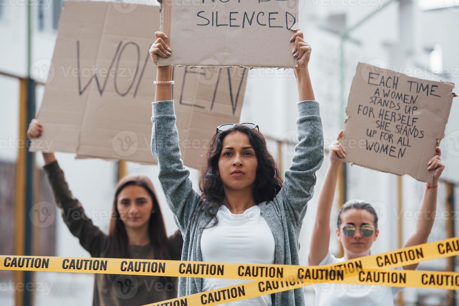 Horizontal shot. Group of feminist women have protest for their rights outdoors photo