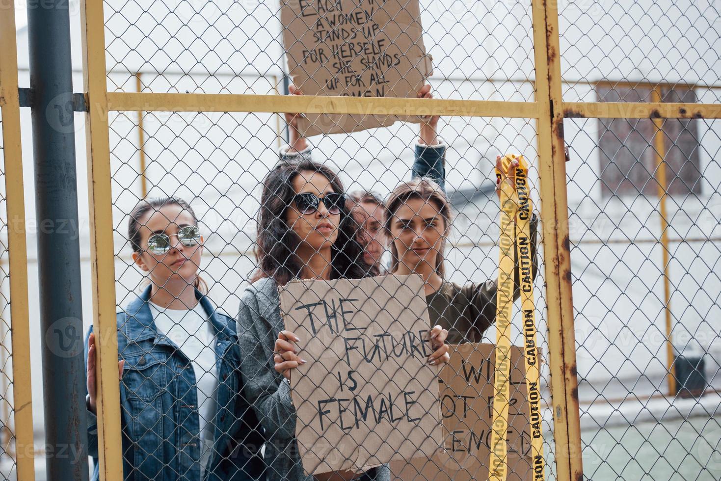 Urban place. Group of feminist women have protest for their rights outdoors photo