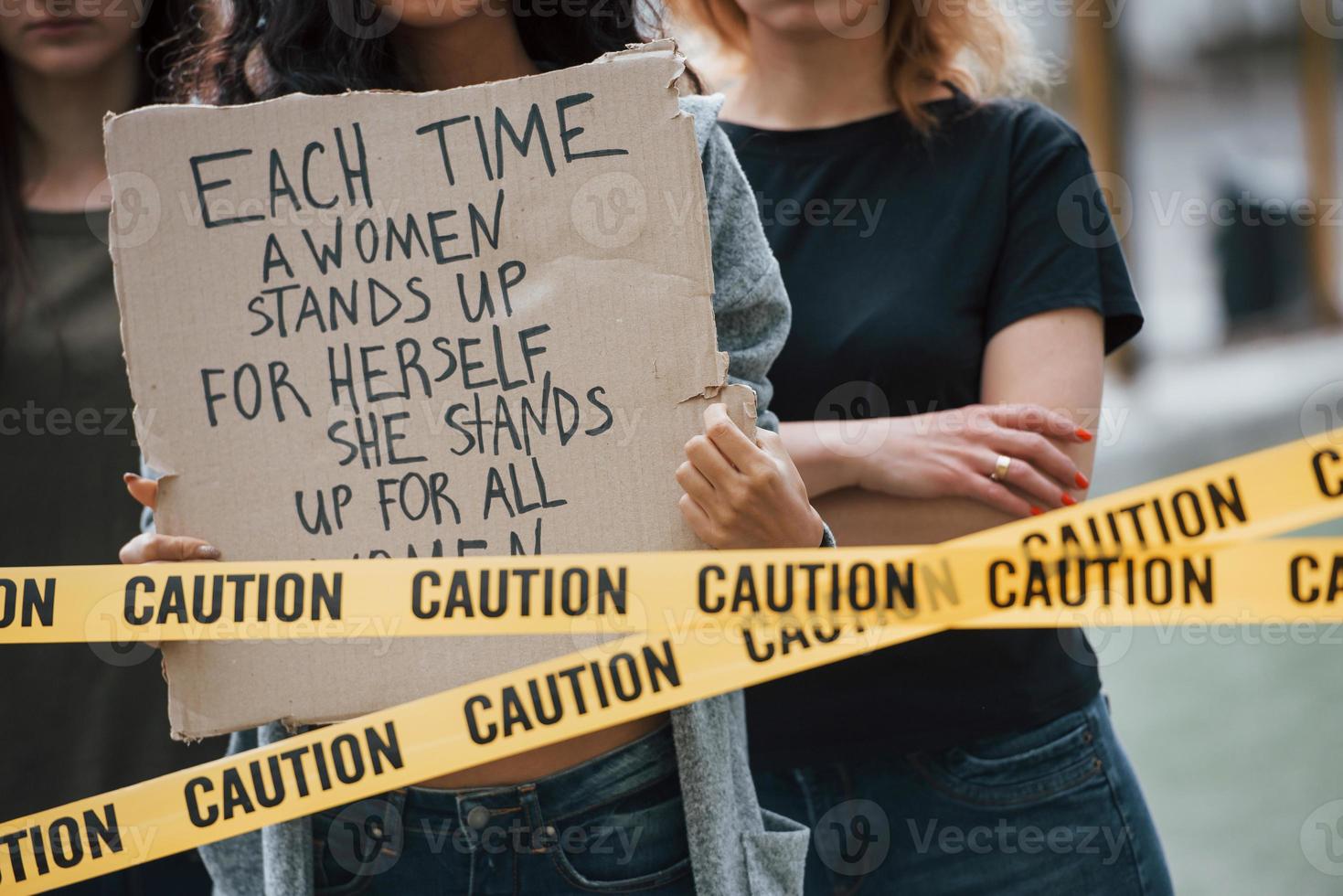Silent protesting people. Group of feminist women have protest for their rights outdoors photo