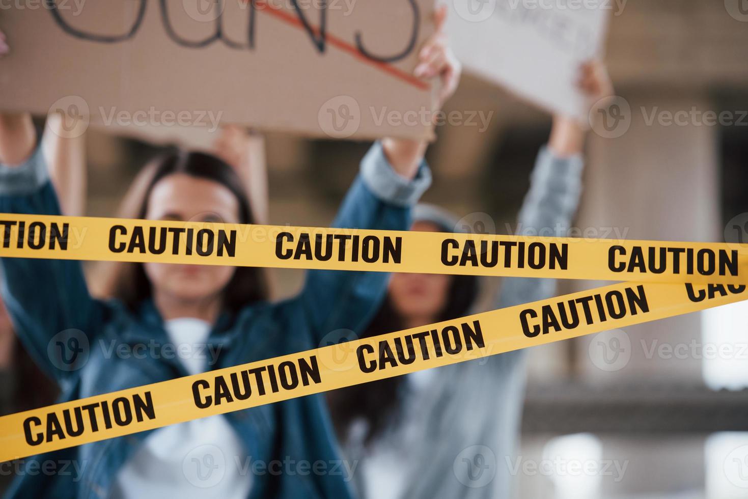 Anonymous people. Group of feminist women have protest for their rights outdoors photo