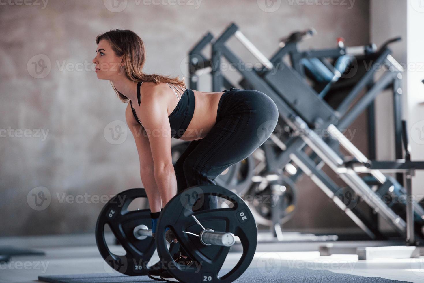 You can do it. Photo of gorgeous blonde woman in the gym at her weekend time