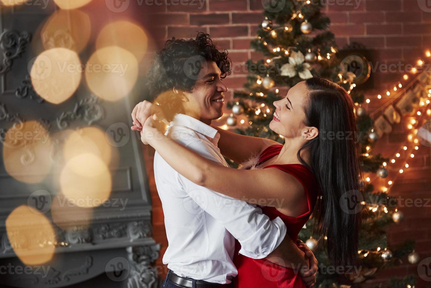 Having good time. New Year's evening dancing. Lovely gorgeous couple spending time together photo