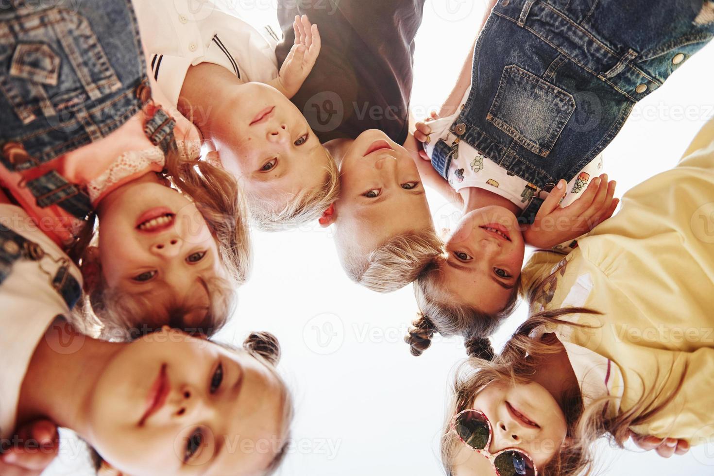 Portrait of kids that standing together and posing for the camera photo