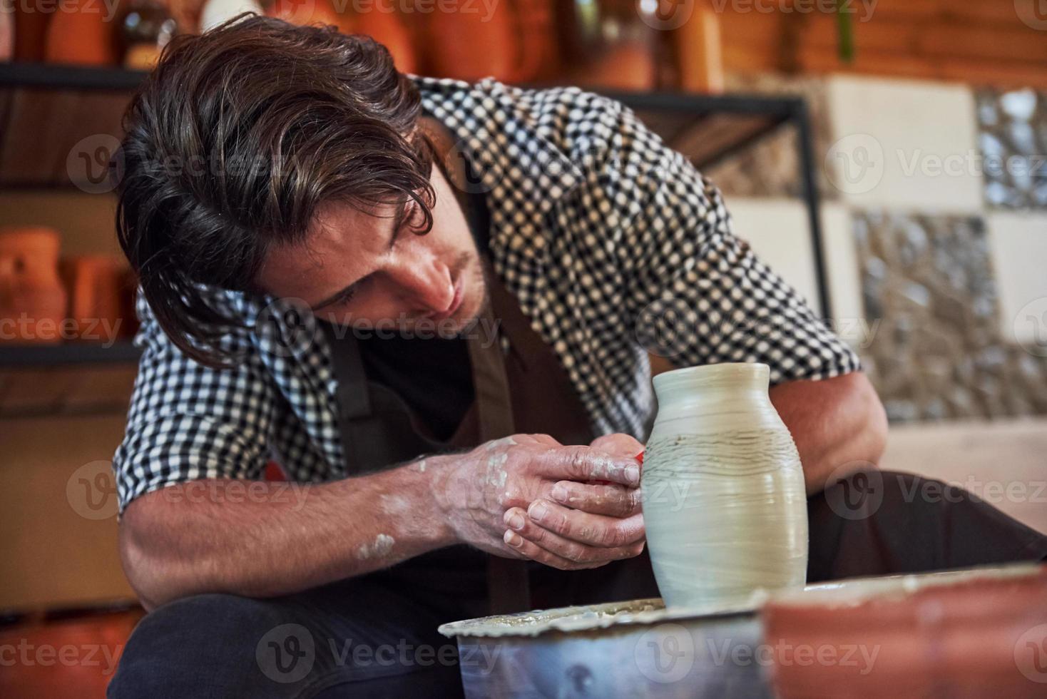 Makes lines with tool. Ceramist uses potter's wheel and creates a
