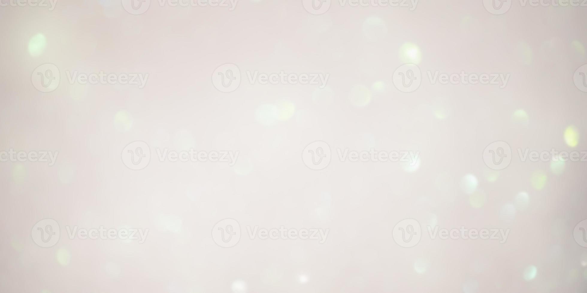 Beige background with green light defocuses. Blurred background material for designers. photo