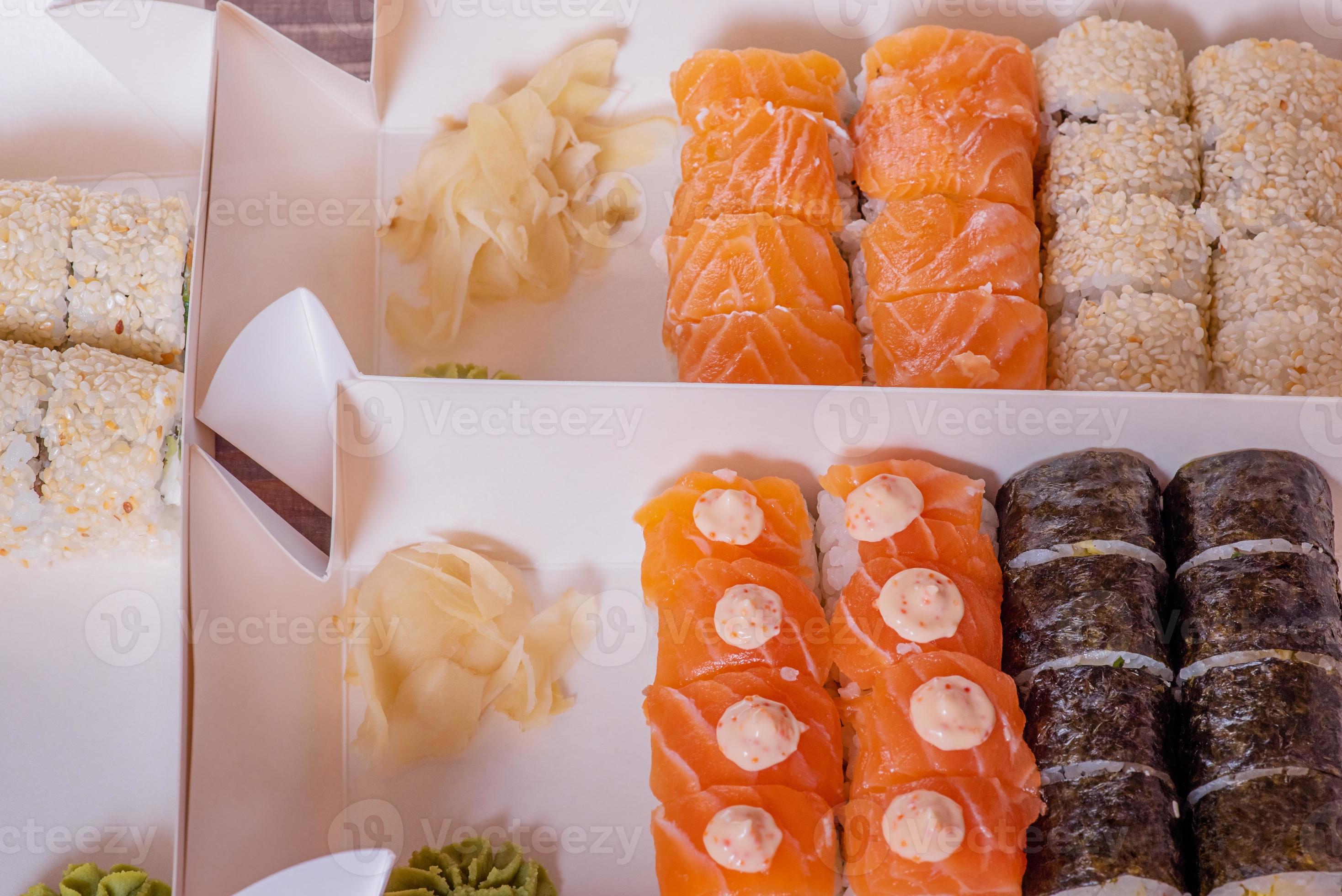 Food delivery Japanese fresh delicious various rolls. Food in paper
