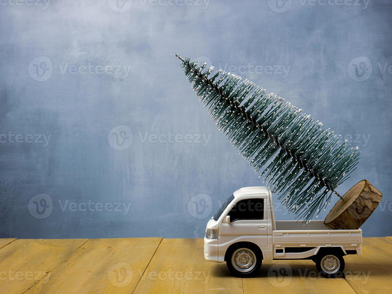 The  Christmas tree on truck for holiday concept photo