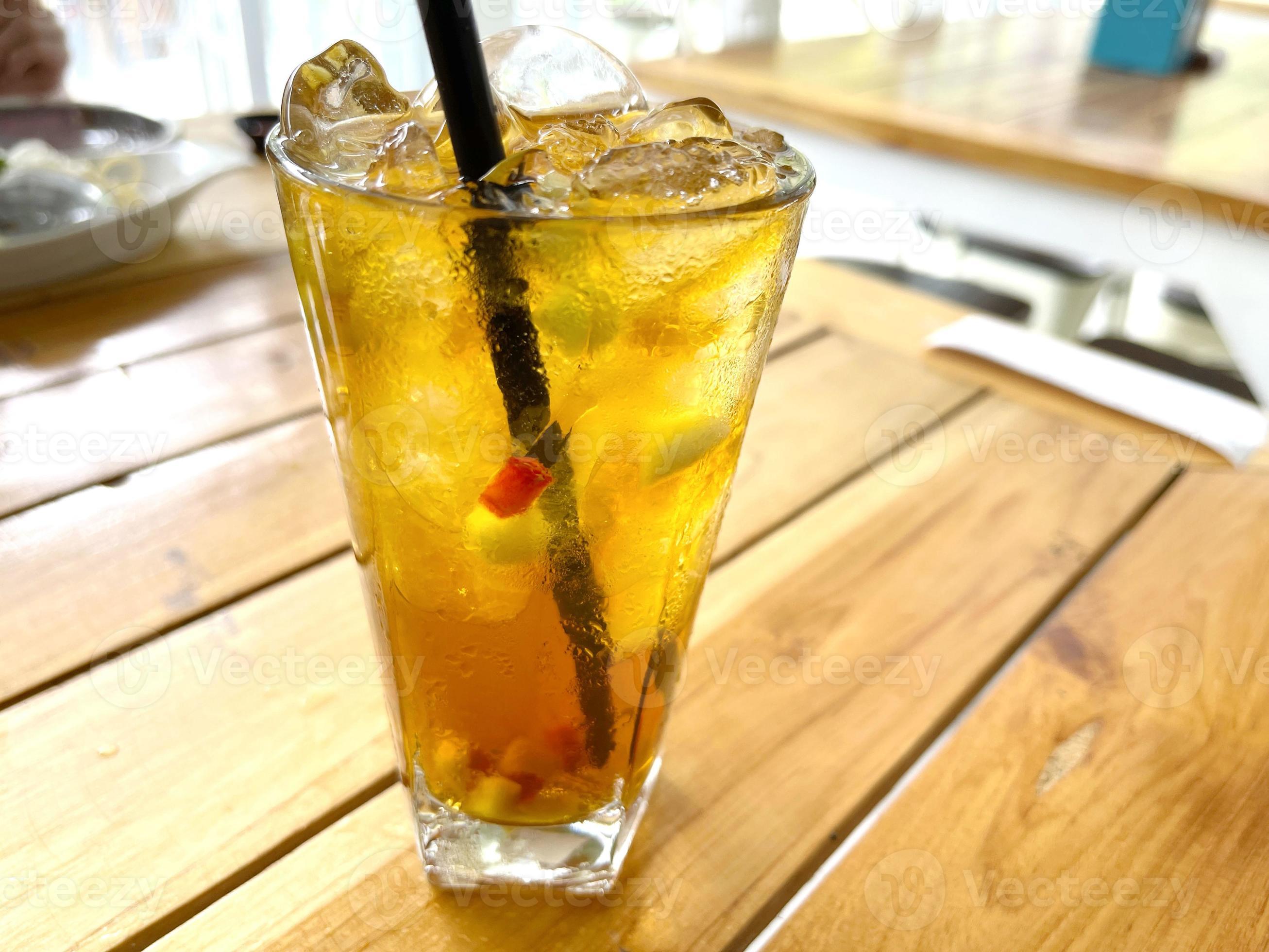 fresh mix fruit cocktail alcohol drink with rum and whiskey in a clear