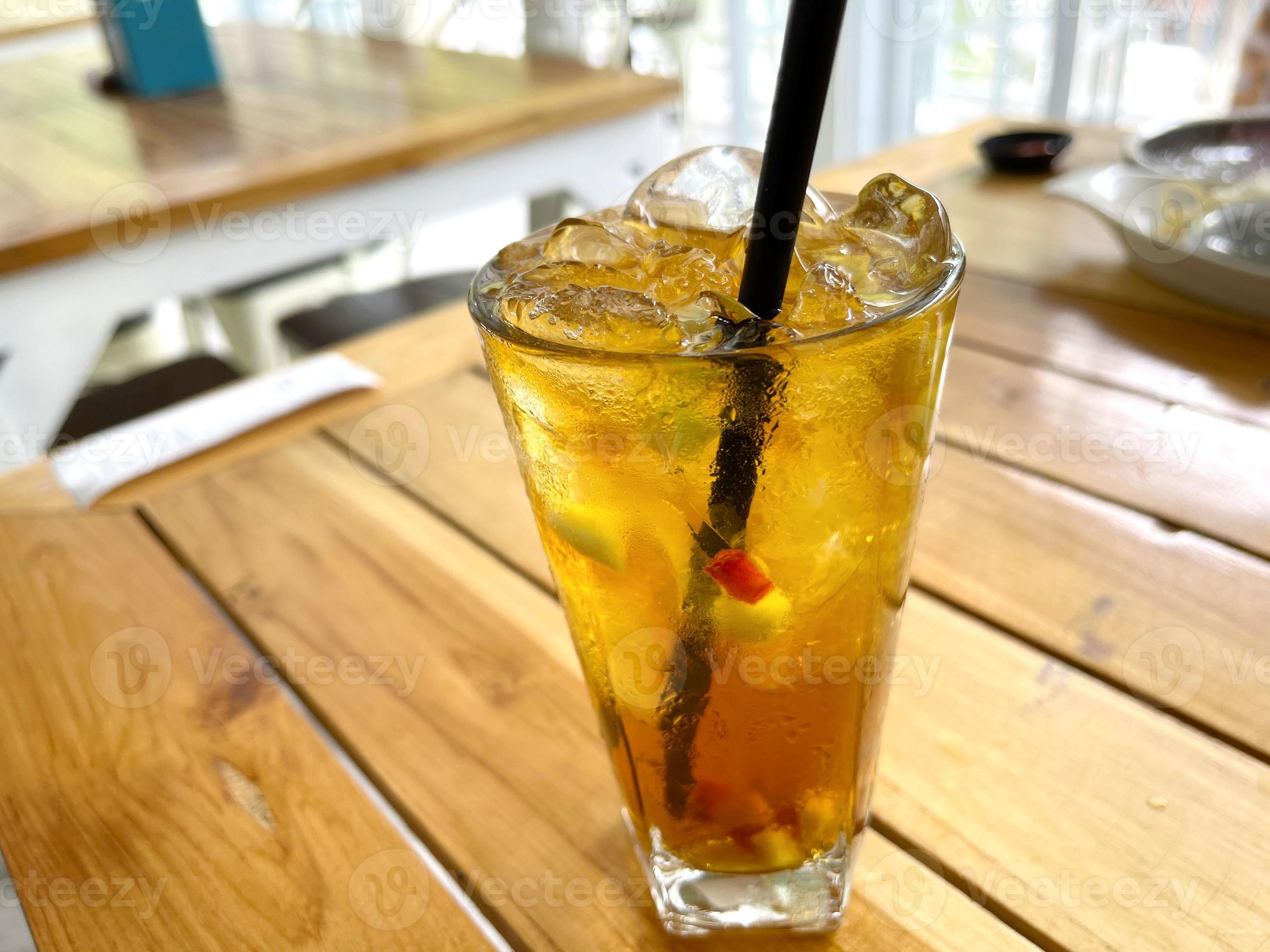 fresh mix fruit cocktail alcohol drink with rum and whiskey in a clear