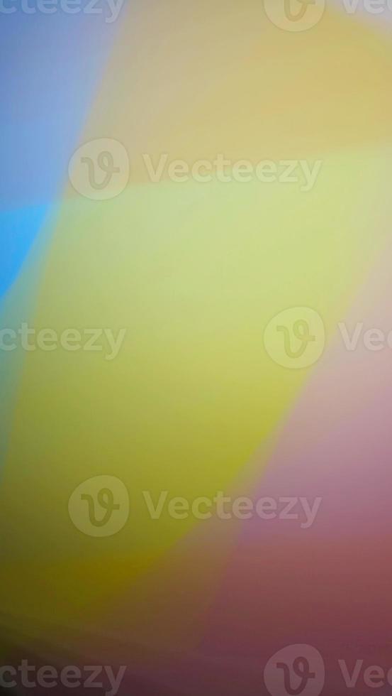 Smooth and blurry colorful gradient mesh background. Purple, yellow, green and black. photo