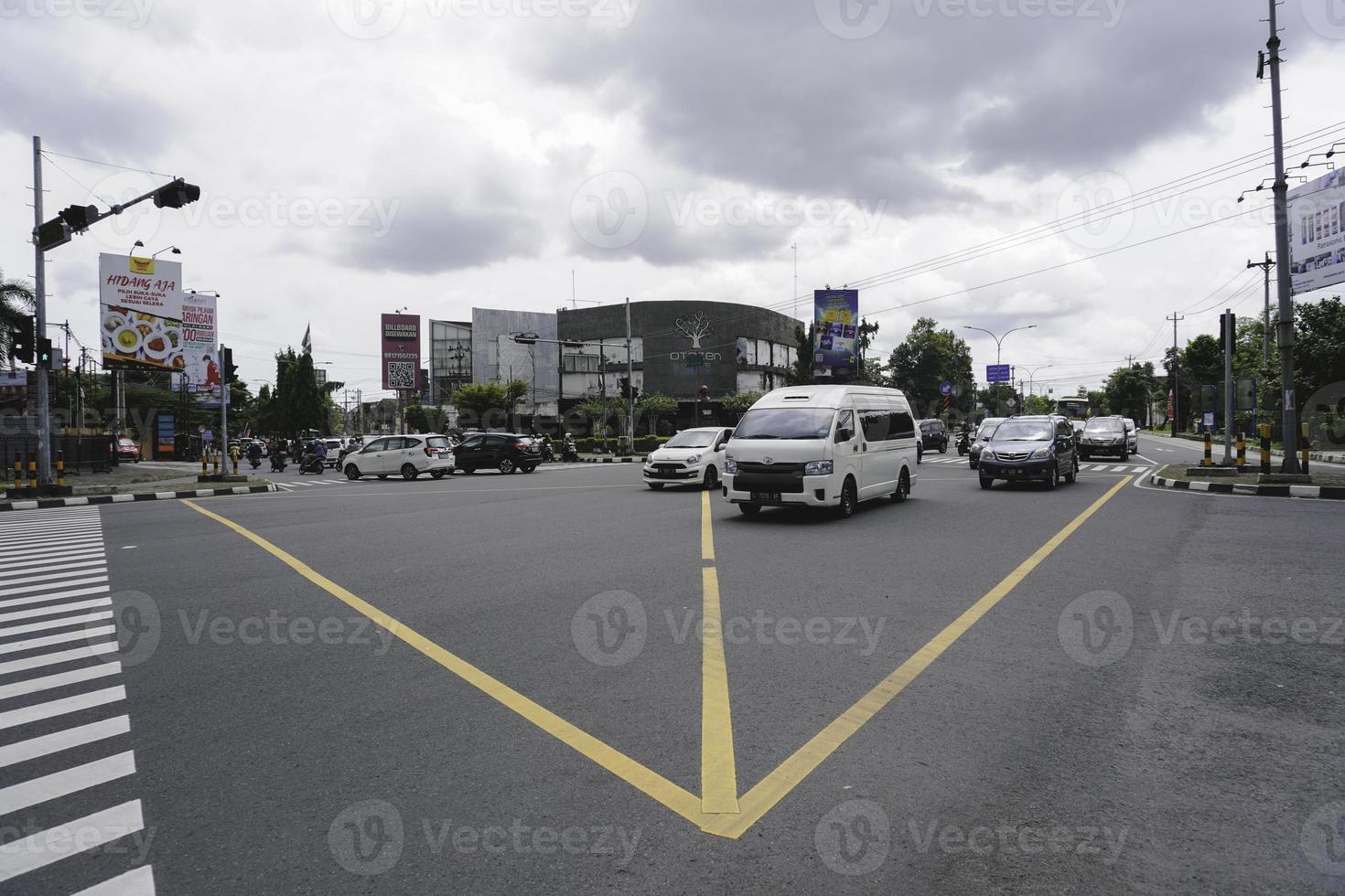 Yogyakarta, Indonesia. November 5th 2022. A portrait of bikers obeys traffic rules by stopping when it red lights photo