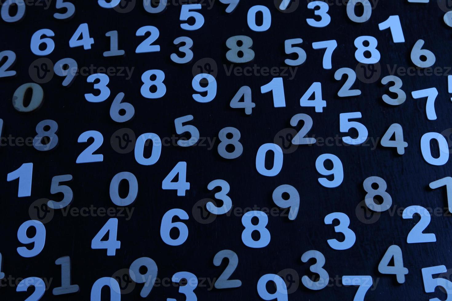 Colorful wooden numbers background. Numbers texture abstraction. Global economy crisis concept. Finance data pattern. photo